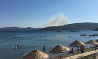Menderes ve Urla'da orman ve makilik alanlarda yangın çıktı