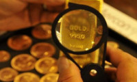 Goldman altın fiyat tahminlerini düşürdü
