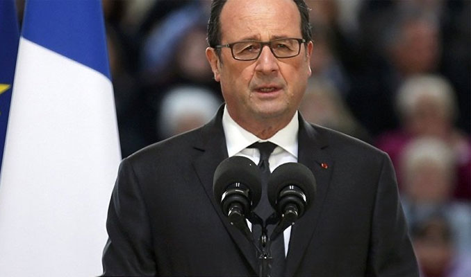 Hollande'ın konuşması sırasında keskin nişancının silahı ateş aldı