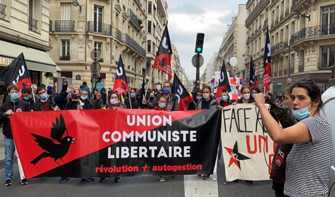 İşçiler, göçmenler Macron'a karşı büyük protesto