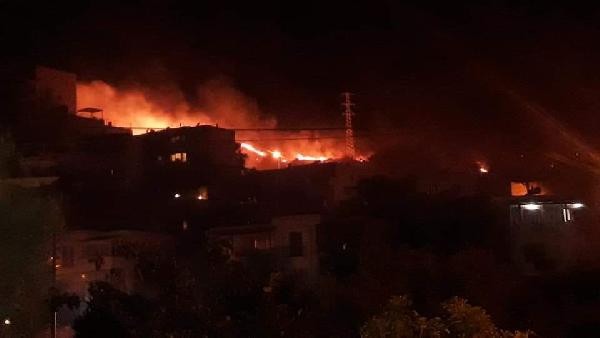 Bodrum'da, yerleşim yeri yakınındaki otluk alanda çıkan yangın korkuttu